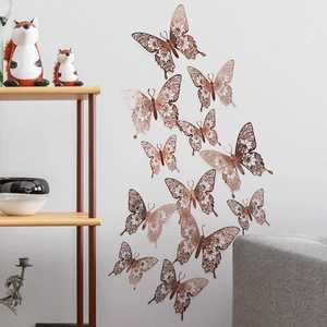 Detailed 3D hollow butterfly wall sticker in rose gold on a clean white background