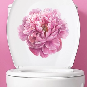 Detailed watercolor pink peony floral sticker applied on a white toilet lid cover