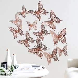 Detailed view of 3D rose gold hollow butterfly wall stickers in a modern home setting