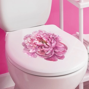Detail of pink peony floral sticker on a toilet lid for bathroom wall decoration