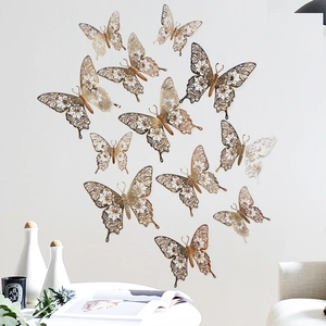 Detail of gold 3D hollow butterfly wall stickers with intricate floral patterns