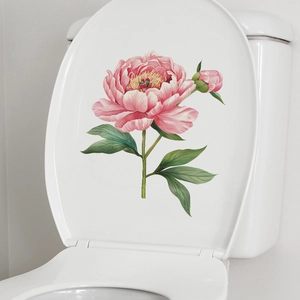 Detail of pink peony flower wall sticker applied on a white toilet lid for bathroom decor