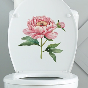 Detail view of pink peony flower wall decal applied to a white bathroom toilet cover