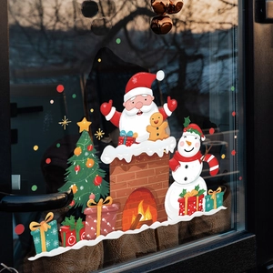 Nahaufnahme von Weihnachtsmann- und Schneemann-Statikaufklebern auf einer Glastür