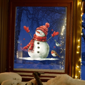 Winter window sticker showing cartoon snowman and birds on a snowy night window