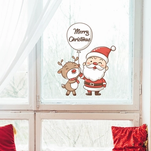 Merry Christmas festive window stickers featuring cartoon Santa Claus and reindeer design