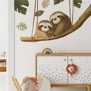 Detailed wall sticker showing two sloths hugging on a tree swing for home decoration