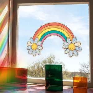 Daisy rainbow window decal suncatcher sticker reflecting vibrant colorful light on glass