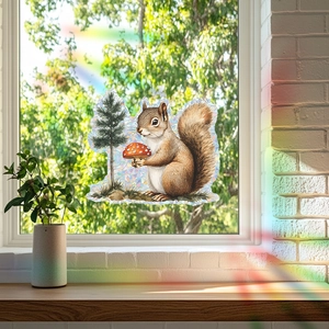 Rainbow prism window decal detail with squirrel and mushroom design under sunlight