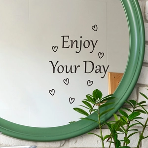Enjoy Your Day heart decal on bathroom mirror with green frame and indoor plants