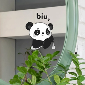Cartoon panda wall sticker with biu text on a round mirror in a modern home interior