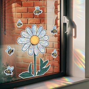 Rainbow suncatcher window decals with daisy and bees creating spectrum light