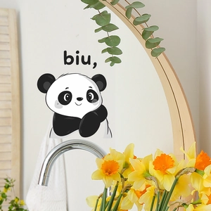 Detail of cute cartoon panda wall sticker applied on a round mirror for home decor