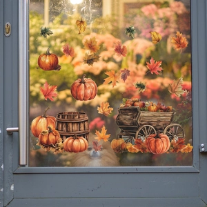 Detail of harvest window decals featuring pumpkins and autumn leaves on glass