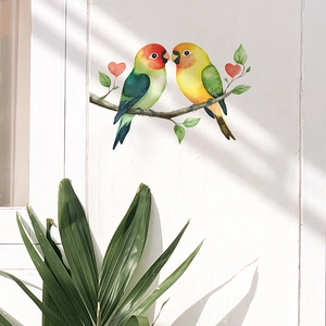 Lovebirds on leafy branch wall sticker with red hearts on white wood background