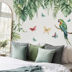 Tropical rainforest wall sticker featuring parrots and monstera leaves in a cozy bedroom