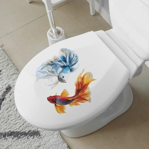 Vibrant Siamese Fighting Fish wall decals for bathroom decor on a white toilet lid