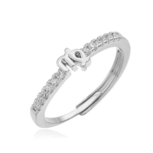 Macro detail of Virgo zodiac ring with paved zircons and adjustable open silver band