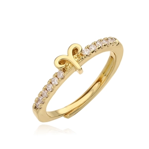 Detail of Aries zodiac sign gold ring featuring sparkling pavé crystals and open band design