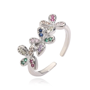 Detail view of adjustable silver ring with colorful cubic zirconia floral butterfly elements