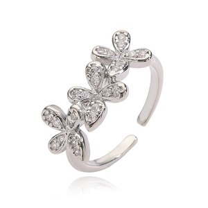 Detail of adjustable silver flower ring featuring three clover motifs with pave cubic zirconia
