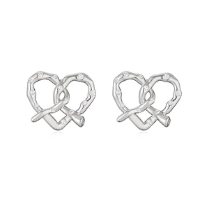 Detailed close-up of heart-shaped pretzel stud earrings with silver plating and cubic zirconia