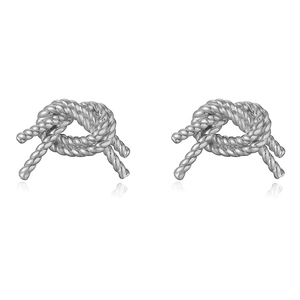 Detailed close-up of silver rope knot stud earrings with polished metallic spiral texture