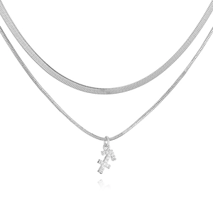 Close-up of double layer silver snake chain necklace featuring a Sagittarius pendant