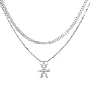 Detail of silver dual-layer snake chain necklace featuring a crystal Pisces pendant
