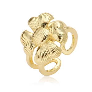 Macro shot of 18K gold plated clover ring featuring textured petals and open band design
