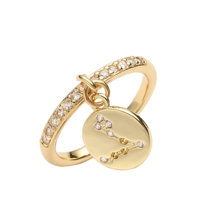 Detail view of gold adjustable zodiac ring featuring a sparkling Pisces pendant with cubic zirconia