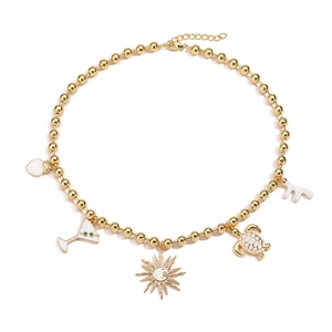 Golden bead necklace featuring white enamel heart, turtle, and sun charms for women