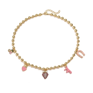 Gold beaded necklace with colorful cherry, heart, and strawberry charms on white background