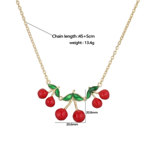 Colorful enamel cherry necklace with red fruits and green leaves on a thin gold chain