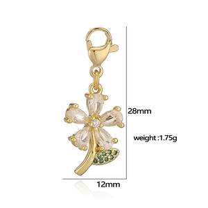 Exquisite gold floral charm with teardrop cubic zirconia and green leaf lobster clasp