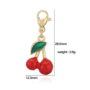 Detail view of red cherry pendant with dimensions 28.5mm by 12.3mm and lobster clasp