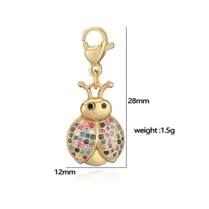 Detail of ladybug pendant with colorful zircon stones and gold plating for DIY jewelry
