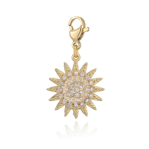 Detailed view of a gold sun pendant with cubic zirconia and a sturdy lobster clasp
