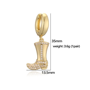 Golden western cowboy boot earrings with sparkling zircon stones on a white background