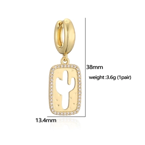 Detail of gold cactus earrings with white zircons and dimensions 38mm by 13.4mm