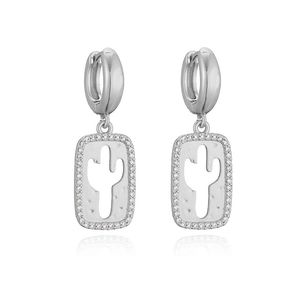 Close-up of silver cactus earrings with rectangular hollow pendants and sparkling diamonds