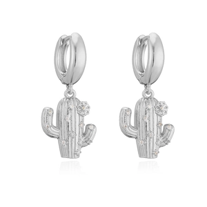 Close-up of silver cactus huggie earrings with white zircon accents and floral detail