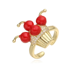Macro view of adjustable cherry cupcake ring with red stones and sparkling zircon pavé