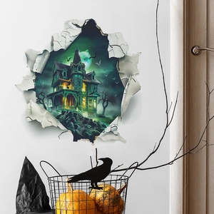 Macro view of a 3D Halloween wall sticker showing a haunted house through a broken wall