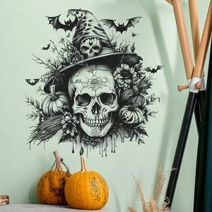 Vue détaillée des stickers Halloween avec crâne et citrouille sur une surface murale verte