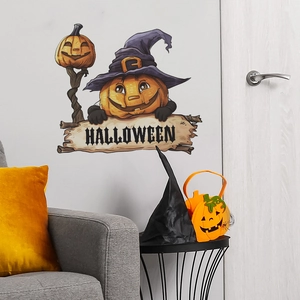 Halloween pumpkin wall decal with purple wizard hat on light gray living room wall