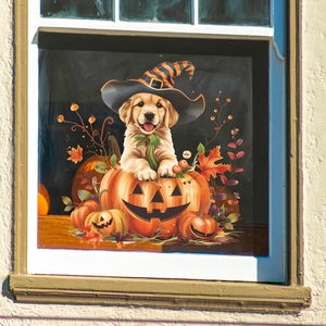 Halloween window sticker with a golden retriever puppy in a pumpkin wearing a witch hat