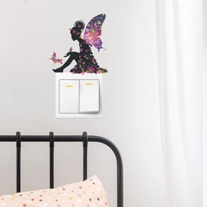 Detail showing fairy wall sticker silhouette with colorful floral patterns near a switch