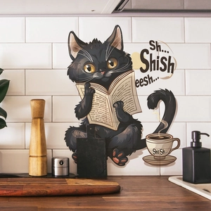 Detail of cute black cat reading a book wall sticker on white kitchen tiles