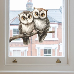 Static cling glass decal featuring two watercolor owls on a branch for home decoration